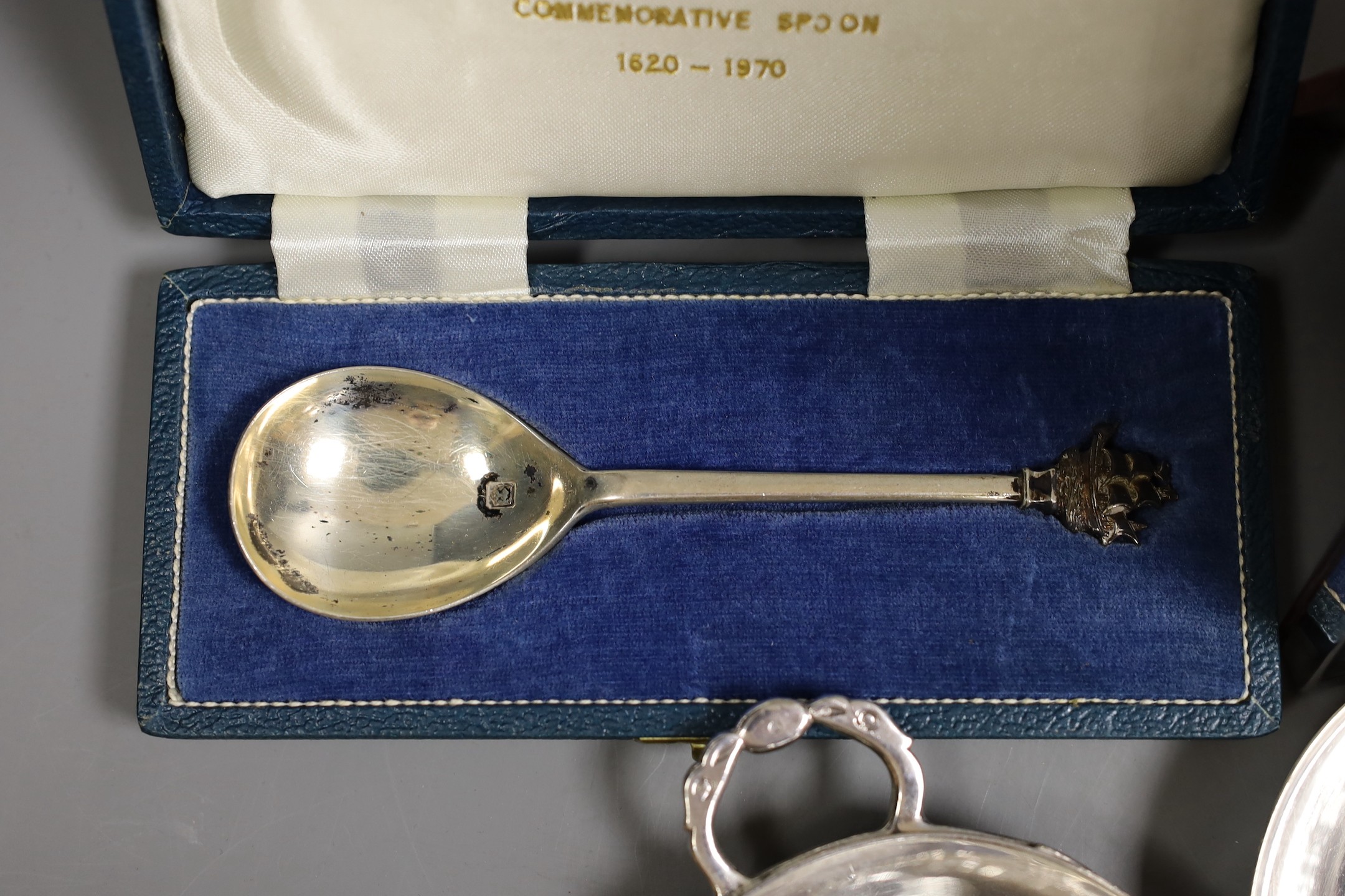 A George I silver octagonal caster, Thomas Bamford, London, 1725, 13.1cm, a cased modern silver commemorative spoon, a cased set of six silver bean end coffee spoons and five plated items.